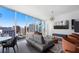 Modern living space with floor-to-ceiling windows showcasing city views, and contemporary furniture at 1080 Peachtree Ne St # 1610, Atlanta, GA 30309