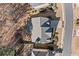 Aerial view showcasing the roof, driveway, and landscaping of the home, nestled within a community at 1775 Unity Loop, Cumming, GA 30040