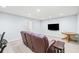 Comfortable basement seating area with a large flatscreen television on the wall at 1775 Unity Loop, Cumming, GA 30040