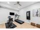 Finished basement space set up as a home gym with treadmill and exercise equipment at 1775 Unity Loop, Cumming, GA 30040