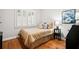 Comfortable bedroom with hardwood floors, shuttered windows, neutral walls and decorative lighting at 1775 Unity Loop, Cumming, GA 30040