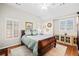 Vaulted bedroom features a cozy bed, window shutters, and decorative mirrors at 1775 Unity Loop, Cumming, GA 30040