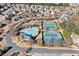 Aerial view of community amenities including a pool, playground, tennis courts, and meticulously landscaped grounds at 1775 Unity Loop, Cumming, GA 30040