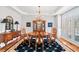 Formal dining room with hardwood floors, plantation shutters, and a stylish chandelier at 1775 Unity Loop, Cumming, GA 30040