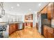 Open kitchen with stainless steel appliances and views into the breakfast nook and a second food-prep space at 1775 Unity Loop, Cumming, GA 30040