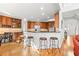 Open kitchen with stainless steel appliances, granite countertops, and a breakfast bar with seating for four at 1775 Unity Loop, Cumming, GA 30040