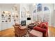 Spacious living room with a fireplace, built-in shelves, and large windows offering ample light at 1775 Unity Loop, Cumming, GA 30040
