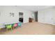 Spacious playroom with neutral carpet, table and access to other rooms at 1775 Unity Loop, Cumming, GA 30040
