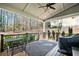 Covered porch with a ceiling fan overlooking a wooded backyard area at 1775 Unity Loop, Cumming, GA 30040