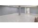 Unfinished basement with gray walls and tile flooring is ready for customization to suit your needs at 1157 Helen St, Morrow, GA 30260