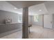 Finished basement features tile flooring, natural light, and neutral paint, perfect for entertaining or relaxing at 1157 Helen St, Morrow, GA 30260