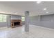 Basement with cozy brick fireplace and abundant natural light for a warm and inviting space at 1157 Helen St, Morrow, GA 30260
