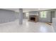 Basement with red brick fireplace, tiled floor, and natural light offers cozy potential at 1157 Helen St, Morrow, GA 30260