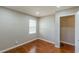 This bedroom has a window and a door to a walk-in closet or bathroom at 1157 Helen St, Morrow, GA 30260