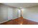 Large bedroom with hardwood floors, neutral paint, and ample closet space at 1157 Helen St, Morrow, GA 30260