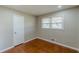 This bedroom has a window and a door, plus it is freshly painted at 1157 Helen St, Morrow, GA 30260
