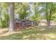 Well-maintained brick home with lush green front yard and mature trees at 1157 Helen St, Morrow, GA 30260