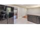 Modern kitchen featuring stainless steel appliances and granite countertops, with tiled floors at 1157 Helen St, Morrow, GA 30260