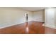 Open-concept living room features hardwood floors, neutral walls, and modern lighting at 1157 Helen St, Morrow, GA 30260