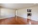Bright living room with hardwood floors and an open doorway to the kitchen at 1157 Helen St, Morrow, GA 30260