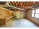 Unfinished basement area with utility connections and a workbench at 4367 S Berkeley Lake Nw Rd, Duluth, GA 30096