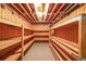 Basement with unfinished ceiling and wood storage shelving at 4367 S Berkeley Lake Nw Rd, Duluth, GA 30096