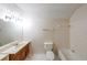 Standard bathroom featuring a single vanity, toilet, mirror, and bathtub at 4367 S Berkeley Lake Nw Rd, Duluth, GA 30096