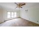 Bedroom with ceiling fan and natural light from the window at 4367 S Berkeley Lake Nw Rd, Duluth, GA 30096