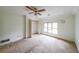 Bedroom with a ceiling fan, closet, and natural light from the window at 4367 S Berkeley Lake Nw Rd, Duluth, GA 30096