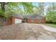Charming brick home featuring an attached garage and a well-kept lawn, offering a classic suburban appeal at 4367 S Berkeley Lake Nw Rd, Duluth, GA 30096