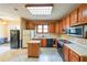 Functional kitchen with ample cabinet space, island, and standard appliances, primed for renovation at 4367 S Berkeley Lake Nw Rd, Duluth, GA 30096