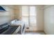Laundry room featuring a side-by-side washer and dryer with built-in shelving and a window at 4367 S Berkeley Lake Nw Rd, Duluth, GA 30096