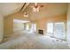 Expansive living room with vaulted ceilings, fireplace, and multiple doors to the exterior, awaits personalization at 4367 S Berkeley Lake Nw Rd, Duluth, GA 30096