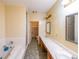 Main bathroom with tub, shower, double sink vanity, and a connecting closet at 4367 S Berkeley Lake Nw Rd, Duluth, GA 30096