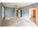 Large main bedroom with multiple doorways, windows, carpet and ceiling fan at 4367 S Berkeley Lake Nw Rd, Duluth, GA 30096