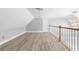Attic area with laminate flooring, neutral paint, and bright, natural light at 1920 Lee Patrick Dr, Dacula, GA 30019