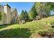 Sprawling backyard with large deck, mature trees, lush lawn and a charming playhouse at 1920 Lee Patrick Dr, Dacula, GA 30019