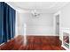 Bright dining room featuring hardwood floors, decorative molding, and an elegant chandelier at 1920 Lee Patrick Dr, Dacula, GA 30019