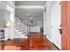 Elegant foyer with hardwood floors, open staircase, and view to the living room, enhancing the home's appeal at 1920 Lee Patrick Dr, Dacula, GA 30019