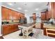 Spacious kitchen with tile flooring, wooden cabinets, a center island and stainless appliances at 1920 Lee Patrick Dr, Dacula, GA 30019