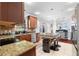 Open kitchen layout features granite countertops, tile backsplash, and stainless steel appliances at 1920 Lee Patrick Dr, Dacula, GA 30019