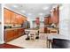 Spacious kitchen with tile flooring, wood cabinets, an island, and stainless steel appliances at 1920 Lee Patrick Dr, Dacula, GA 30019