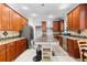 Spacious kitchen with stainless steel appliances, island, granite counters, and wooden cabinets at 1920 Lee Patrick Dr, Dacula, GA 30019