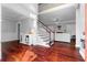 Spacious living room boasts hardwood floors, staircase, and a fireplace, perfect for gatherings at 1920 Lee Patrick Dr, Dacula, GA 30019