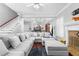 Spacious living room with a cozy fireplace, hardwood floors, and an open concept layout at 1920 Lee Patrick Dr, Dacula, GA 30019