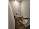 Carpeted staircase with wooden railings, offering safe and stylish access to different levels of the home at 4860 Station Lane -Lot 23, Union City, GA 30349