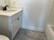 Bathroom featuring a vanity with a white quartz countertop and undermount sink at 5099 Noble Village Way, Lilburn, GA 30047