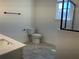 Bathroom with white quartz counters, white walls, and a glass enclosed shower at 5099 Noble Village Way, Lilburn, GA 30047