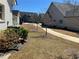 View of the grounds, featuring newly planted trees and modern air conditioning unit at 5099 Noble Village Way, Lilburn, GA 30047
