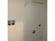Laundry room featuring white walls, washer hookups and upper shelf at 5099 Noble Village Way, Lilburn, GA 30047